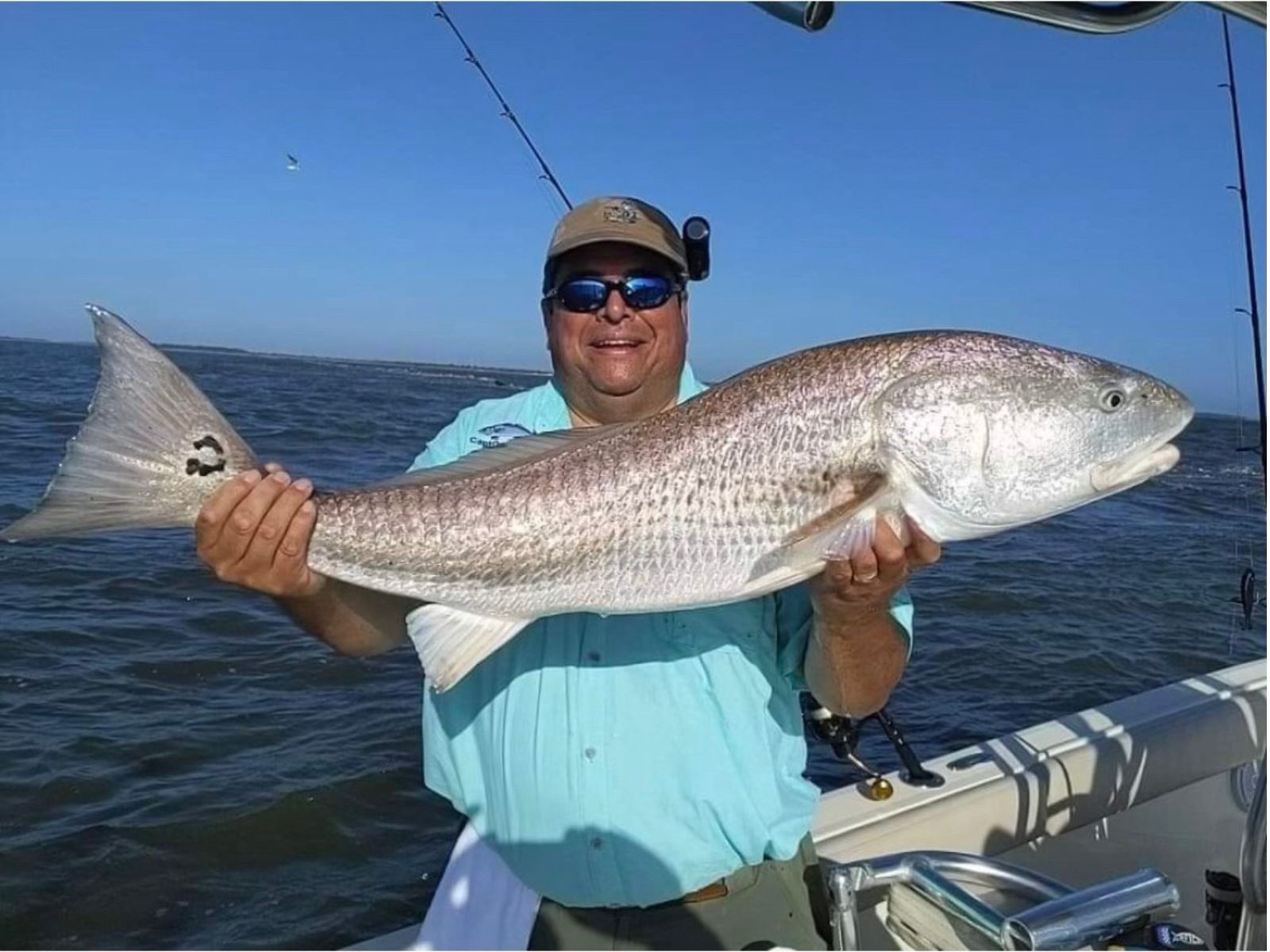 Fisherman Holding a Trophy Bull Redfish